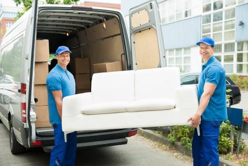 Removal team handling house moving equipment in Roehampton