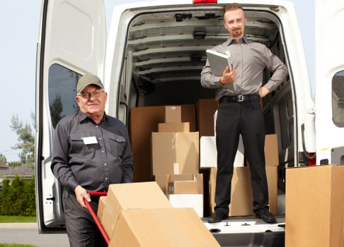 Moving team preparing items safely with protective gear