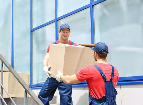 Students moving boxes during a Roehampton relocation