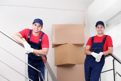 Local van moving boxes and home items in Roehampton