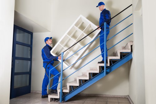 House removals team transporting furniture in Roehampton