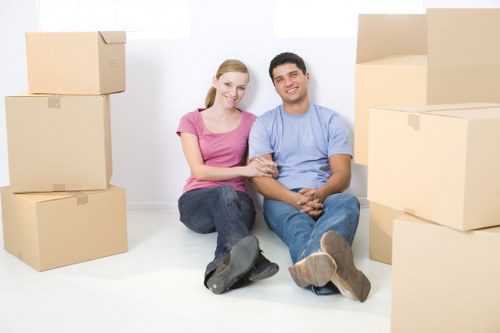 Careful loading of belongings into a Roehampton removal van