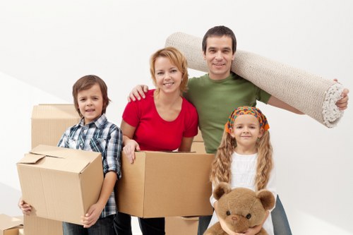 Loading furniture into a moving truck in Roehampton