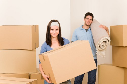 Professional movers handling office furniture during a Roehampton relocation