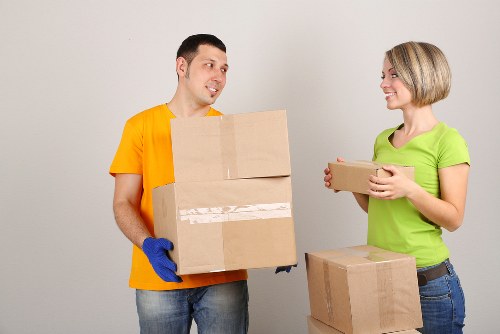 Professional movers handling office furniture during a Roehampton relocation