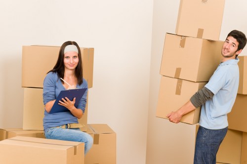 Packed boxes and labelled office items ready for commercial removals